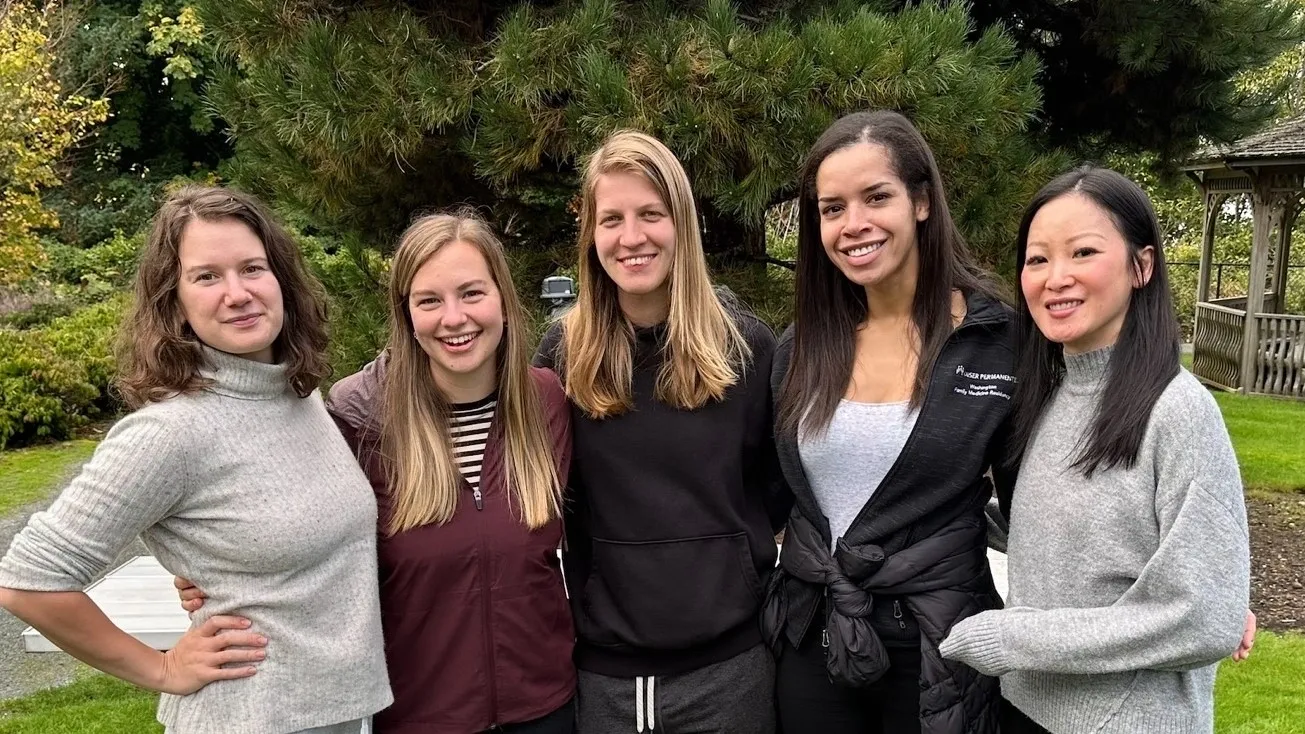 A group of women standing next to each other.